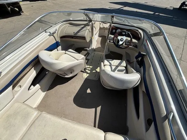Slide: The Image of 2004 Glastron GX 185 boat interior with seating and steering wheel. - 8