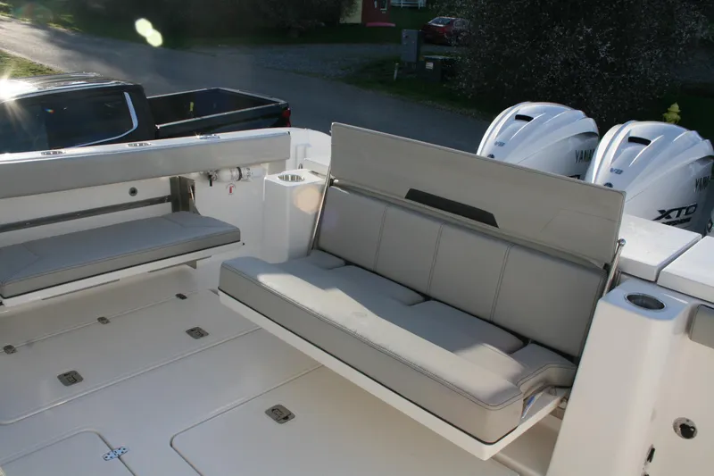 Slide: The Image of 2025 Pursuit OS 405 Offshore boat with cushioned seating and Yamaha engines. - 15