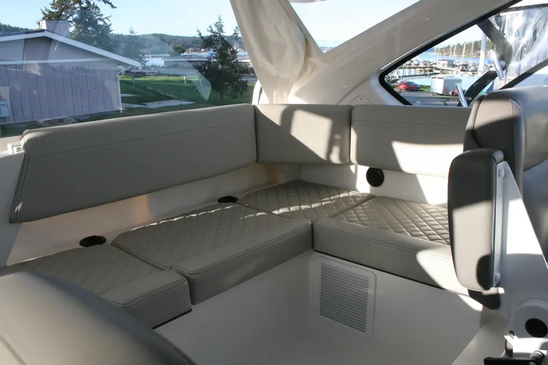 Slide: The Image of Luxurious seating area on the 2025 Pursuit OS 405 Offshore boat. - 16