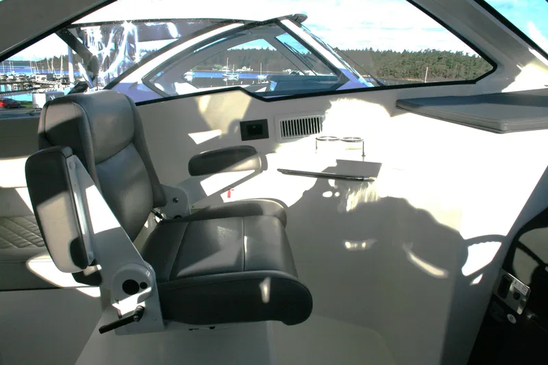 Slide: The Image of 2025 Pursuit OS 405 Offshore boat interior with leather seating and modern design. - 18