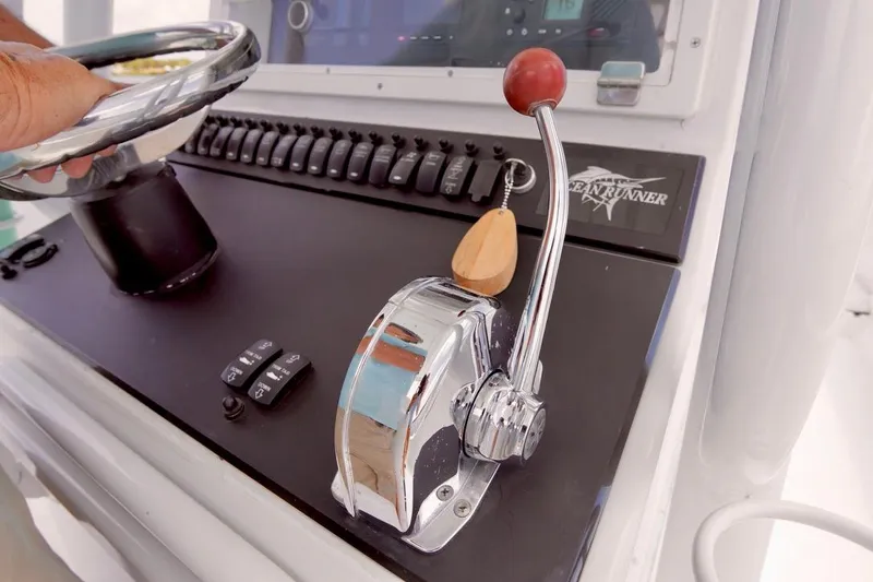 Slide: The Image of Close-up of 1993 Ocean Runner 27 CC boat control panel and throttle. - 16