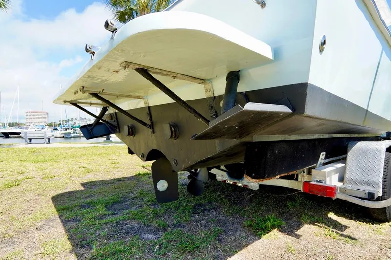 Slide: The Image of 1993 Ocean Runner 27 CC boat on trailer, rear view showing hull and propeller. - 26
