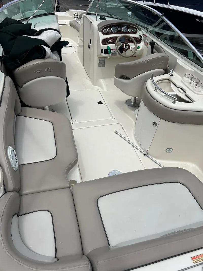 Slide: The Image of 2003 Sea Ray 270 boat interior with seating, steering wheel, and control panel. - 12