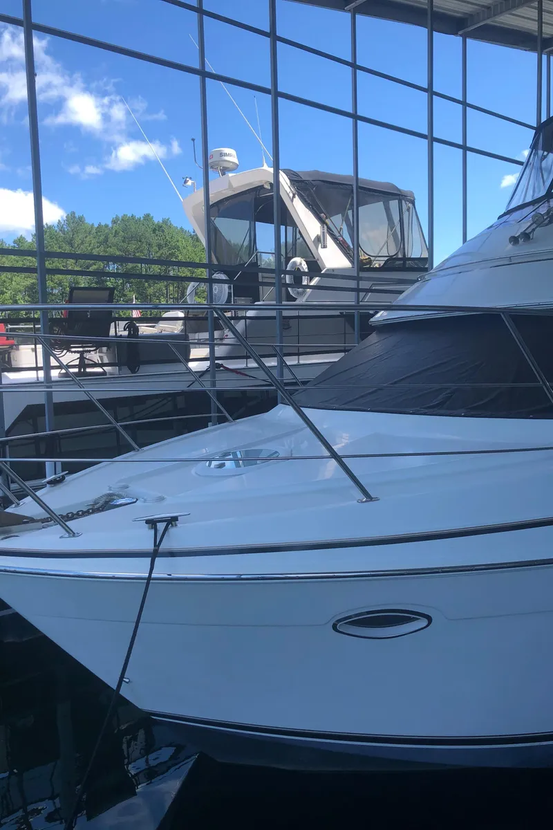 Slide: The Image of 2005 Carver 41 Cockpit Motor Yacht docked in a marina. - 4