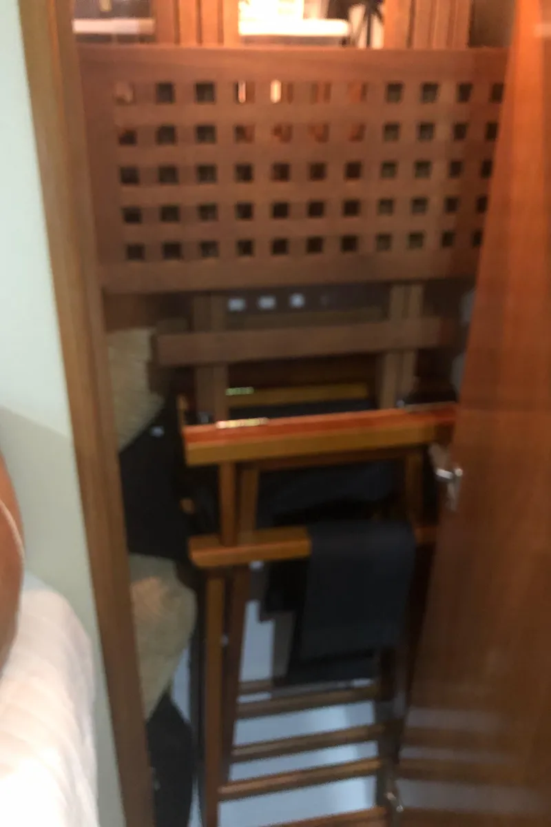 Slide: The Image of Storage area inside 2005 Carver 41 Cockpit Motor Yacht with wooden furniture. - 49