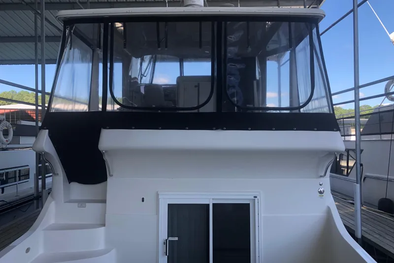 Slide: The Image of 2005 Carver 41 Cockpit Motor Yacht with enclosed upper deck. - 9