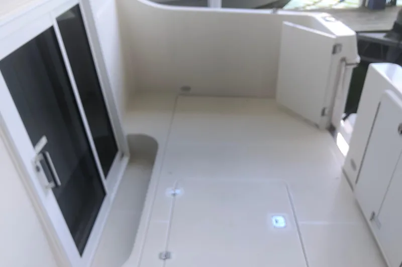 Slide: The Image of 2005 Carver 41 Cockpit Motor Yacht, spacious cockpit area with sliding glass doors. - 10