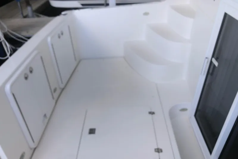 Slide: The Image of 2005 Carver 41 Cockpit Motor Yacht, spacious cockpit with storage compartments and steps. - 11
