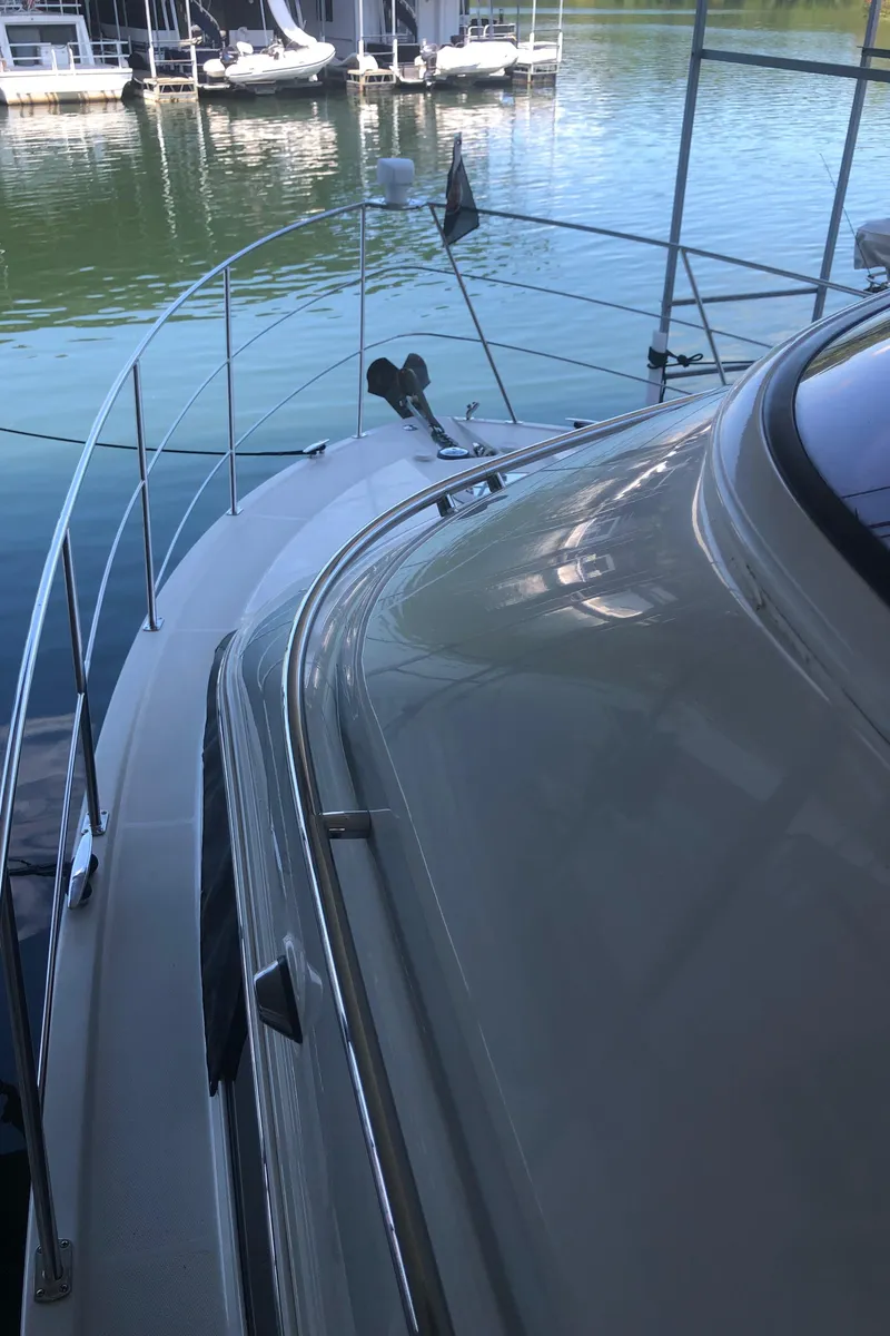 Slide: The Image of 2005 Carver 41 Cockpit Motor Yacht docked at a marina. - 19