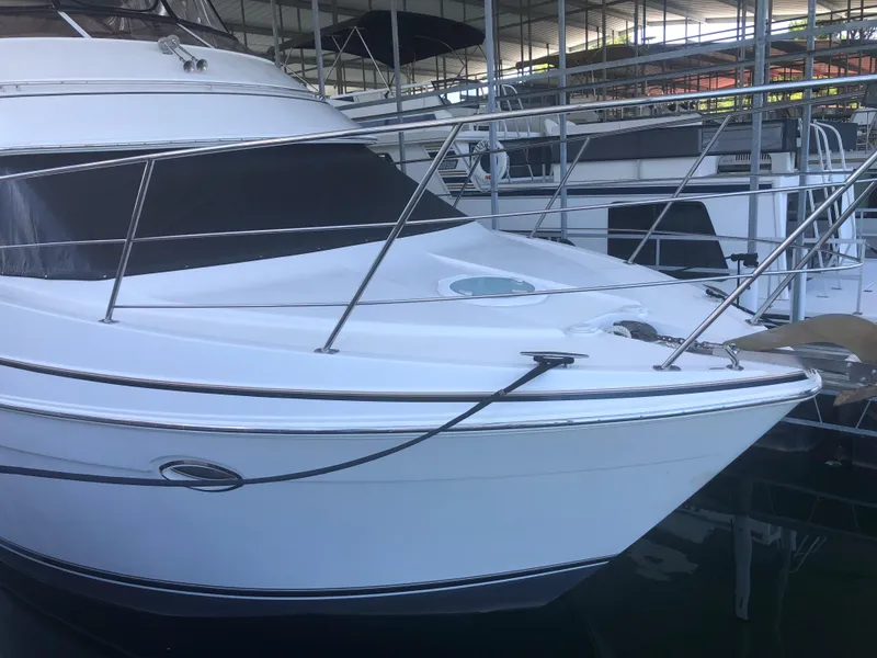 Slide: The Image of 2005 Carver 41 Cockpit Motor Yacht docked in a marina. - 2