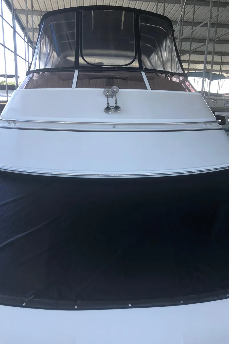 Slide: The Image of 2005 Carver 41 Cockpit Motor Yacht in a covered marina. - 21