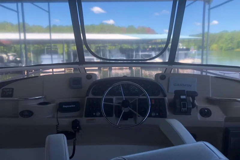 Slide: The Image of Helm of 2005 Carver 41 Cockpit Motor Yacht with Garmin navigation system. - 28