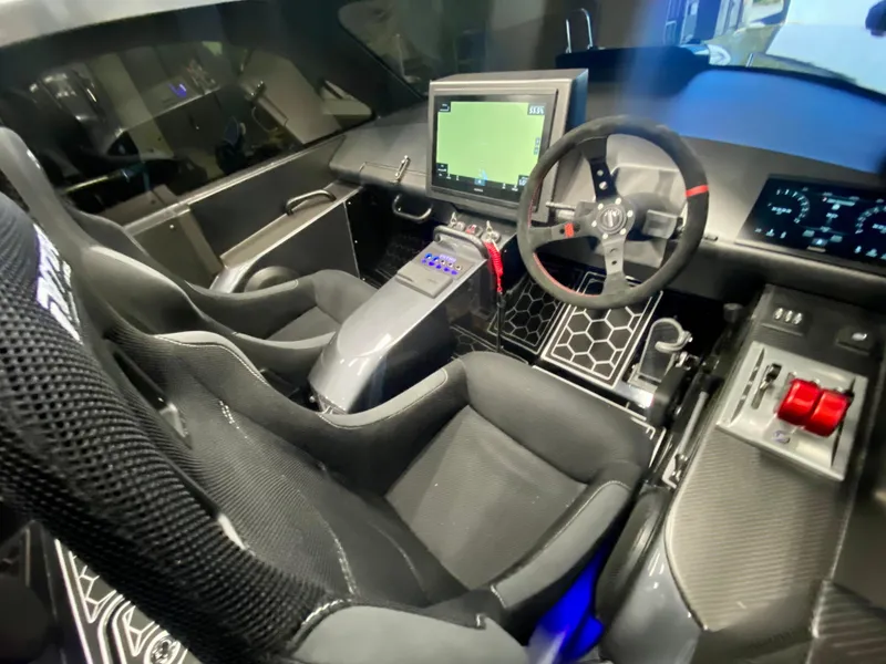 Slide: The Image of 2024 Nitra Boats 30 SkyTop cockpit with advanced navigation system and ergonomic seating. - 12