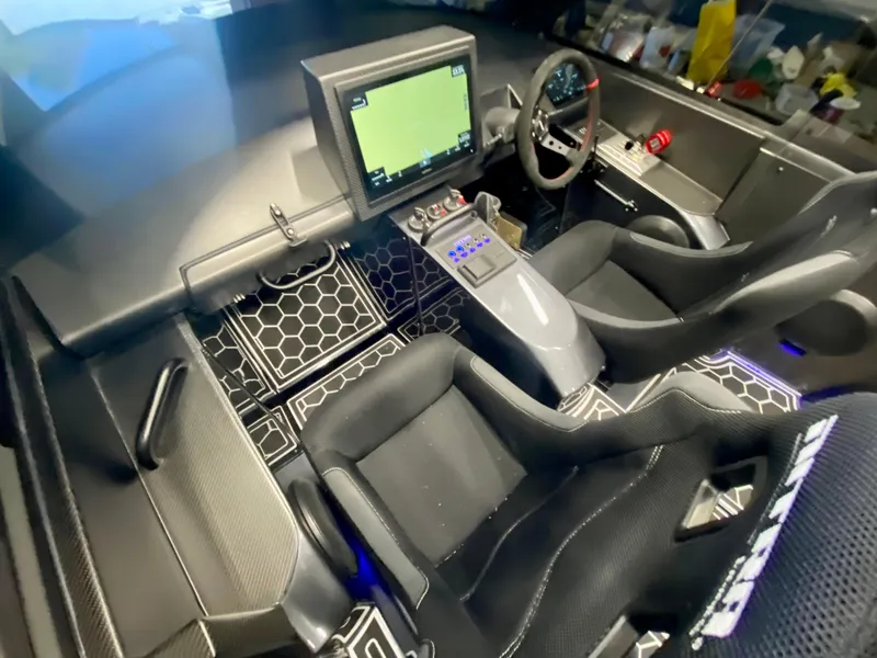 Slide: The Image of 2024 Nitra Boats 30 SkyTop cockpit with advanced navigation system and ergonomic seating. - 14