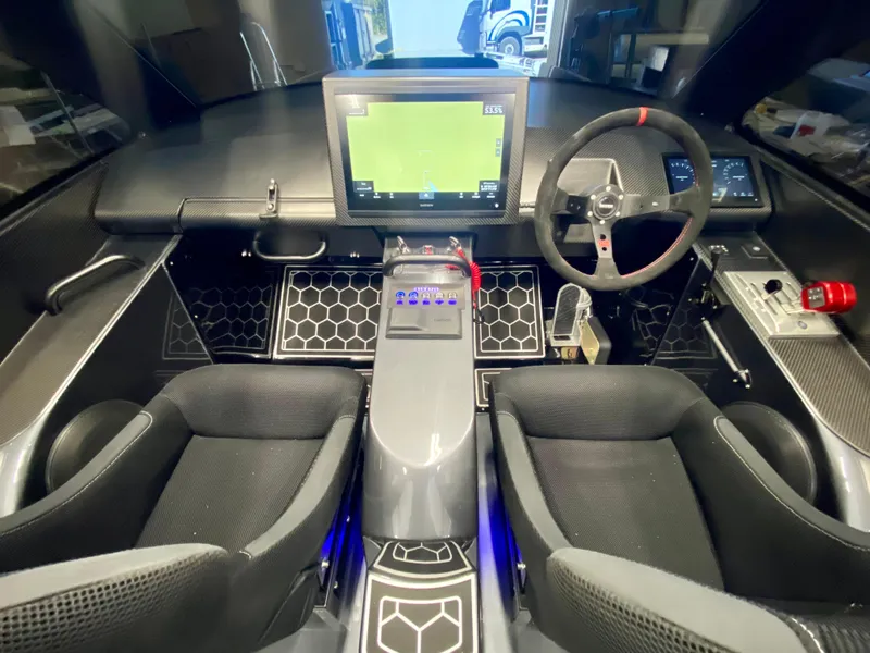 Slide: The Image of 2024 Nitra Boats 30 SkyTop cockpit with modern navigation system and dual seats. - 15