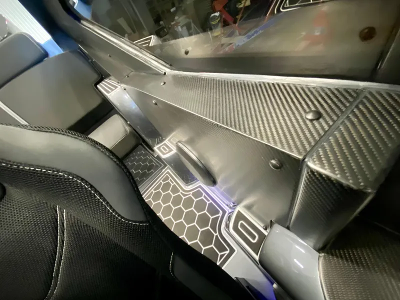 Slide: The Image of Interior of 2024 Nitra Boats 30 SkyTop with carbon fiber detailing. - 17