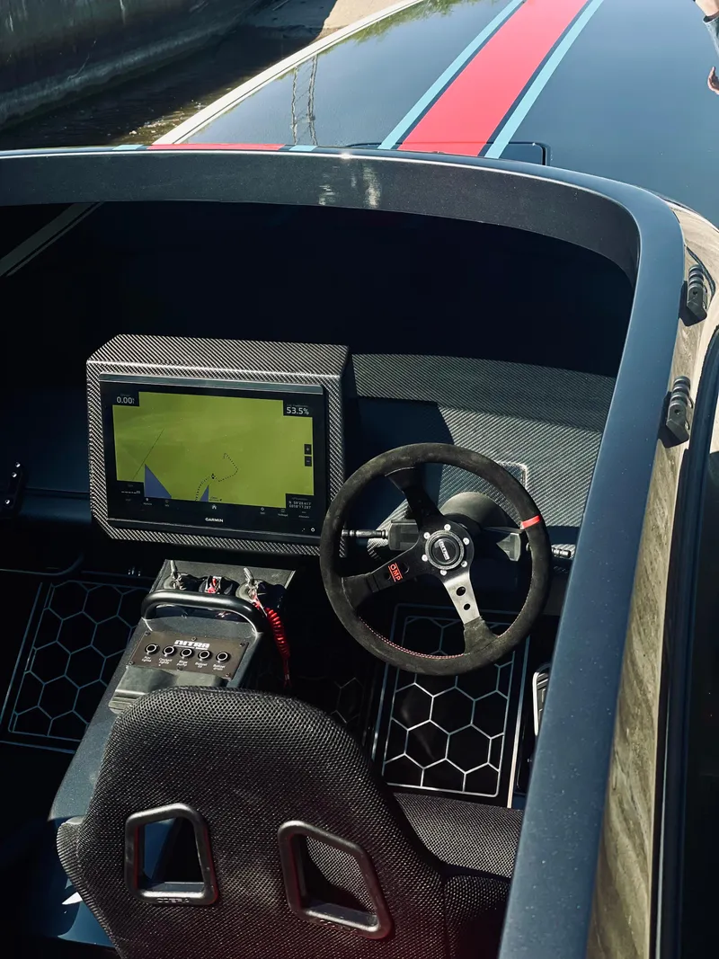 Slide: The Image of 2024 Nitra Boats 30 SkyTop cockpit with advanced navigation system and sleek design. - 7