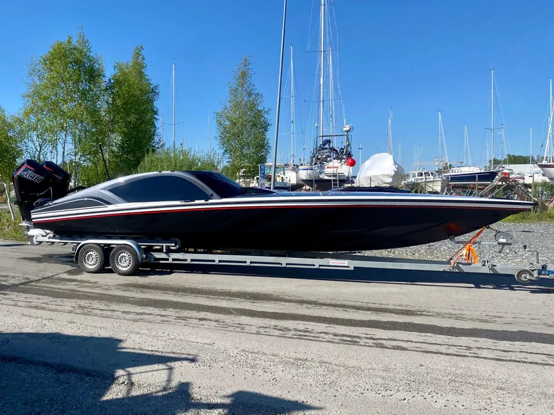 Slide: The Image of 2024 Nitra Boats 30 SkyTop on trailer at marina. - 8