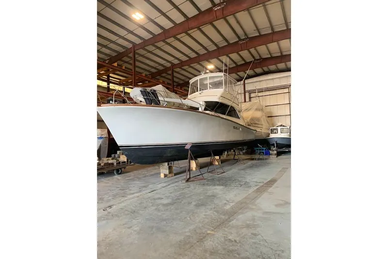 Slide: The Image of 1989 Ocean Yachts 44 Super Sport Custom in storage, showcasing sleek design and craftsmanship. - 24