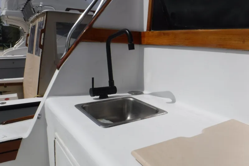 Slide: The Image of 1989 Ocean Yachts 44 Super Sport Custom yacht sink and faucet detail. - 28