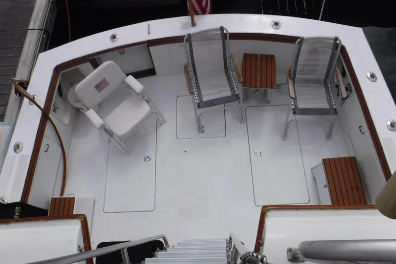 Slide: The Image of 1989 Ocean Yachts 44 Super Sport Custom deck with chairs and tables, docked at marina. - 34