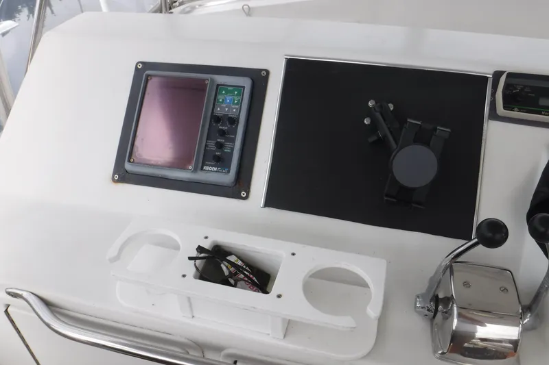 Slide: The Image of Control panel of 1989 Ocean Yachts 44 Super Sport Custom with navigation equipment. - 36