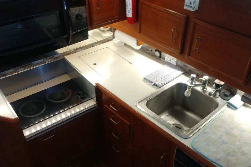 Slide: The Image of Galley kitchen in 1989 Ocean Yachts 44 Super Sport Custom with stove and sink. - 8