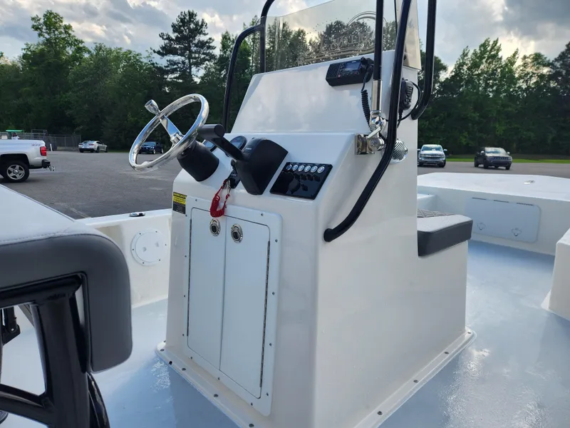 Slide: The Image of 2025 May-Craft 22 Hancock Edition boat console with steering wheel and controls. - 11