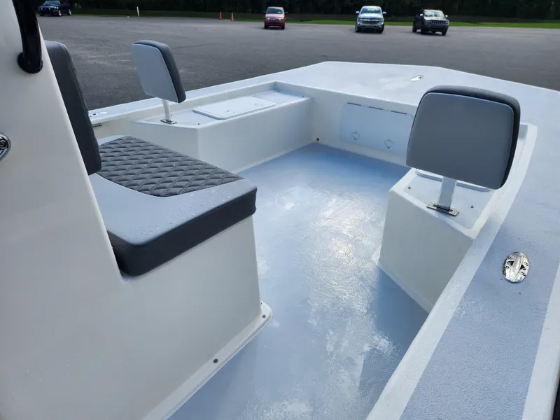 Slide: The Image of 2025 May-Craft 22 Hancock Edition boat interior with seating and storage. - 7