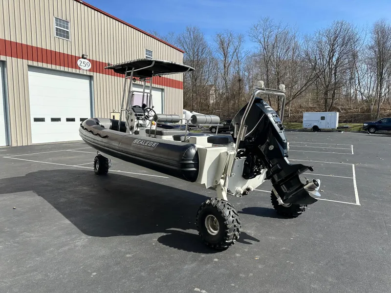 Slide: The Image of 2013 Sealegs 7.1m RIB amphibious boat parked outside a warehouse. - 4
