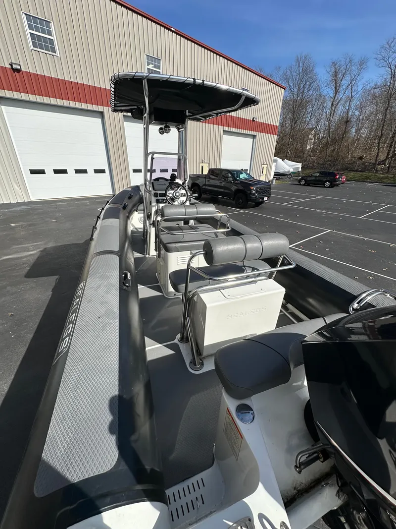 Slide: The Image of 2013 Sealegs 7.1m RIB boat parked outside a warehouse. - 5