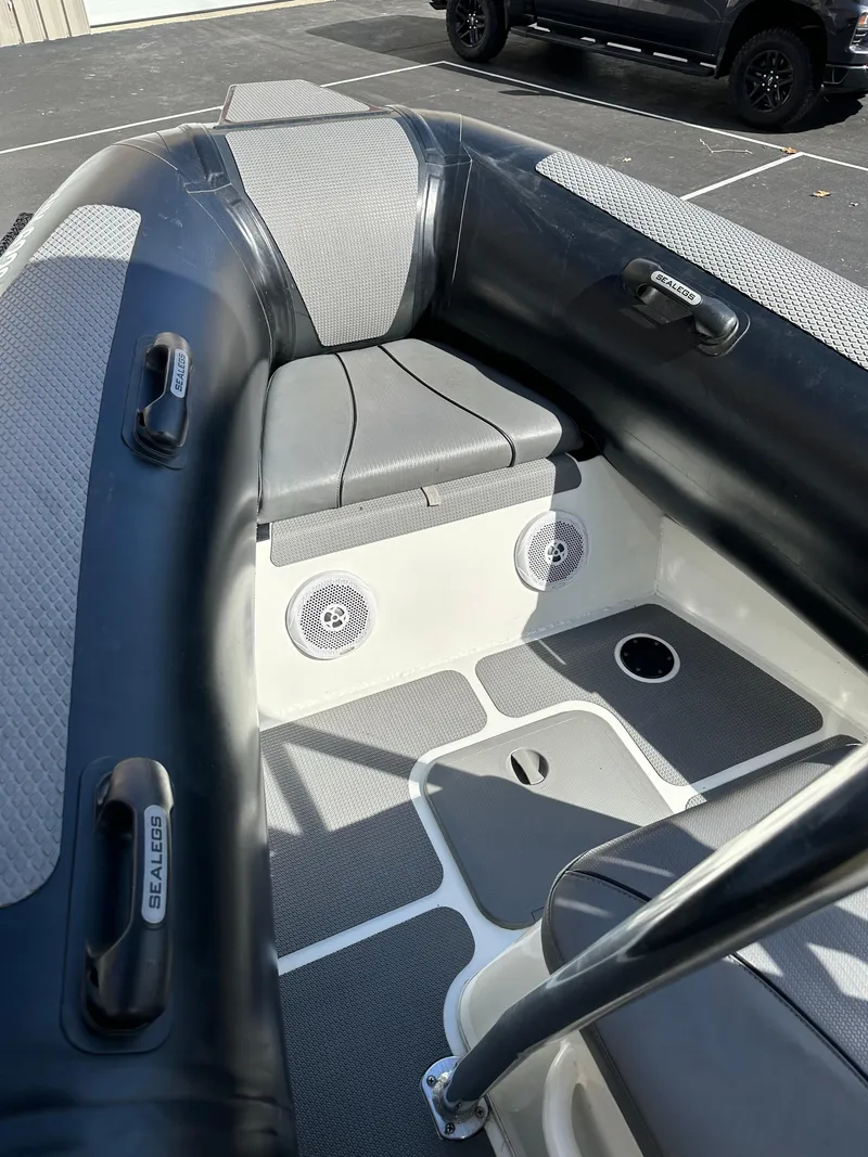 Slide: The Image of 2013 Sealegs 7.1m RIB interior with seating and storage compartments. - 8