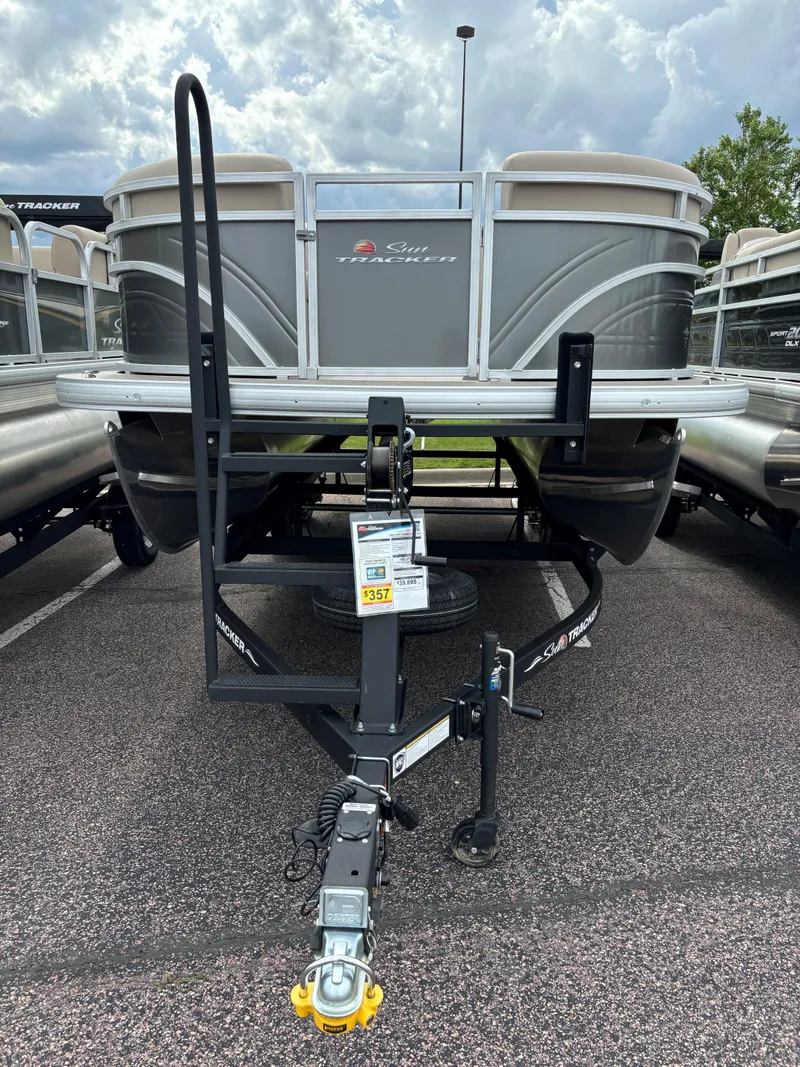 Slide: The Image of 2024 Sun Tracker Party Barge 20 DLX pontoon boat on trailer. - 2