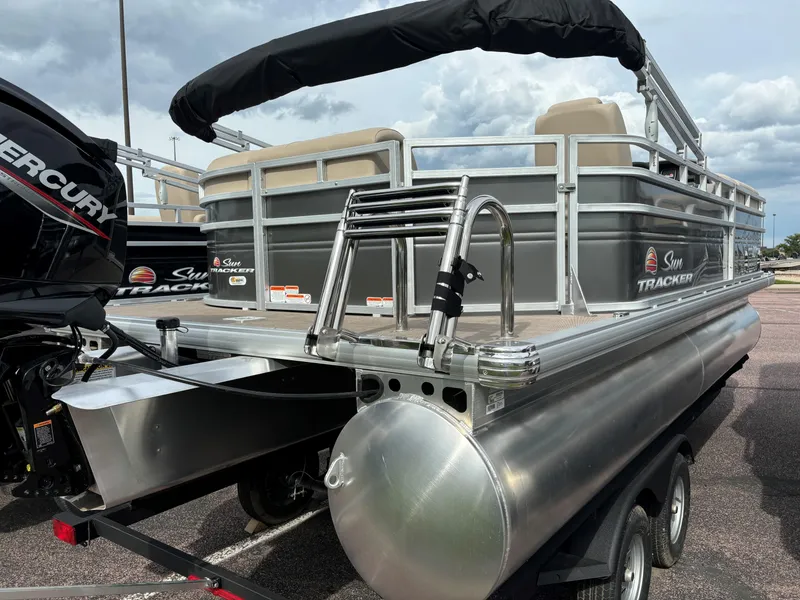 Slide: The Image of 2024 Sun Tracker Party Barge 20 DLX pontoon boat with Mercury engine, rear view. - 3
