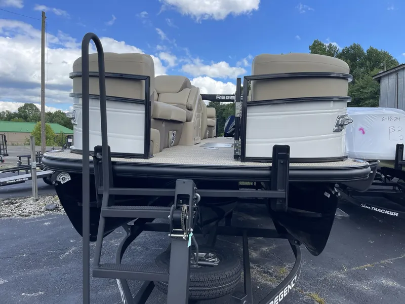 Slide: The Image of 2024 Regency 230 DL3 pontoon boat on trailer, rear view. - 1