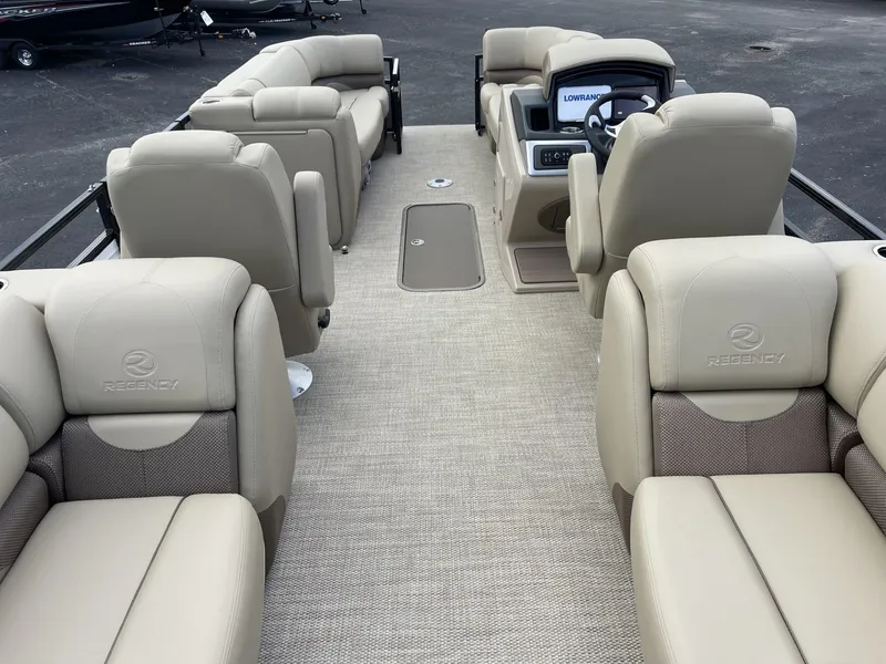 Slide: The Image of 2024 Regency 230 DL3 pontoon boat with luxurious beige seating. - 10