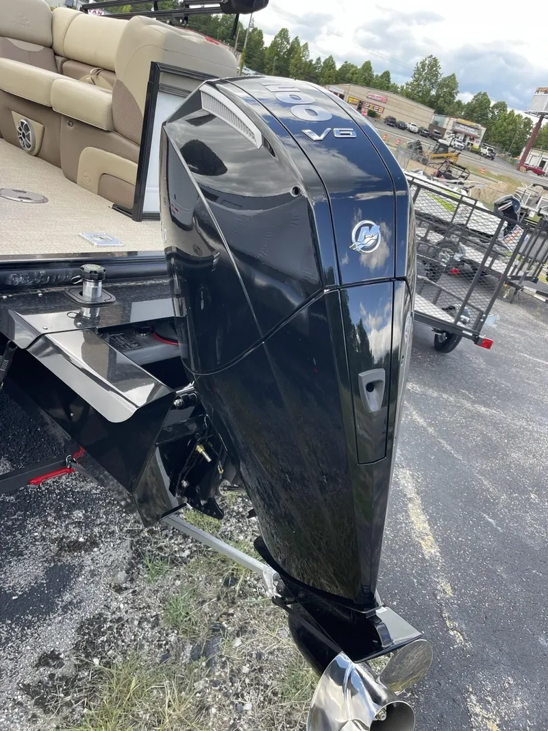 Slide: The Image of 2024 Regency 230 DL3 boat with powerful outboard motor. - 3