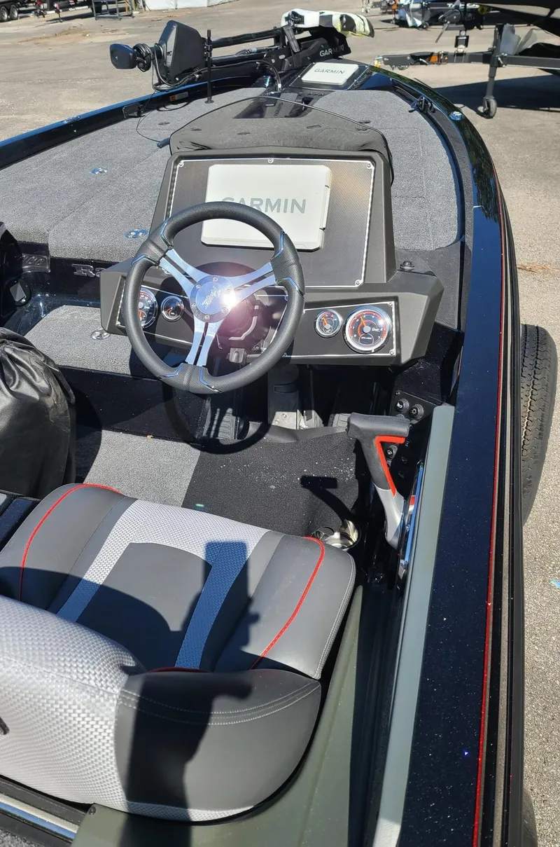 Slide: The Image of 2024 Ranger Z518 Garmin Ranger Cup boat interior with steering wheel and dashboard. - 3