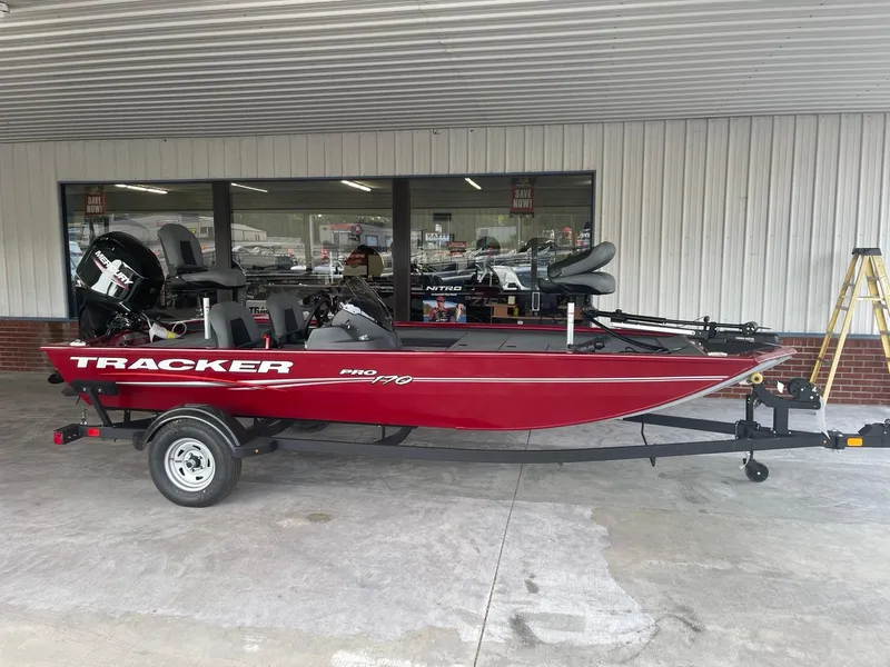 Slide: The Image of 2024 Tracker Pro 170 red fishing boat on trailer. - 8