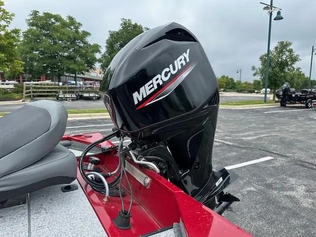 Slide: The Image of 2024 Tracker Pro 170 boat with Mercury outboard motor in parking lot. - 5