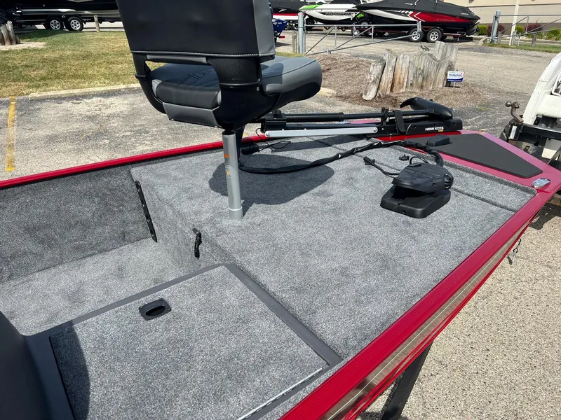 Slide: The Image of 2024 Tracker Bass Tracker Classic XL boat with gray carpeted deck and swivel seat. - 3