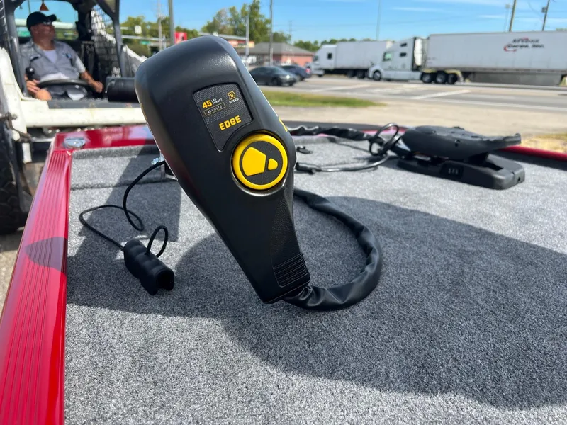 Slide: The Image of 2024 Tracker Bass Tracker Classic XL boat control panel on carpeted deck. - 6