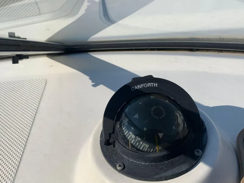 Slide: The Image of Close-up of a Danforth compass on a 1998 Maxum 2800 SCR boat. - 17