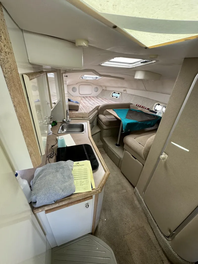 Slide: The Image of Interior of 1998 Maxum 2800 SCR boat with kitchen and seating area. - 20