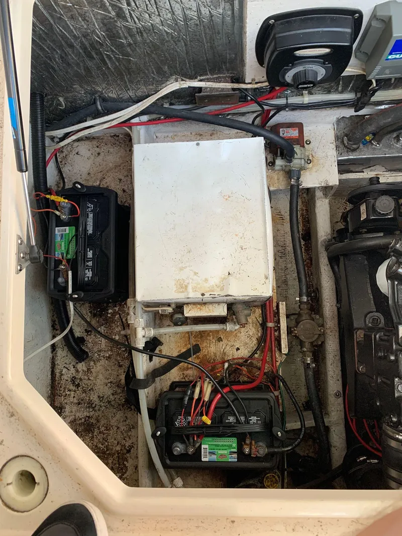 Slide: The Image of Engine compartment of a 1998 Maxum 2800 SCR boat showing battery and wiring. - 33