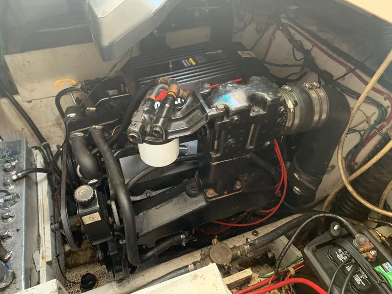 Slide: The Image of 1998 Maxum 2800 SCR engine compartment with visible components and wiring. - 35