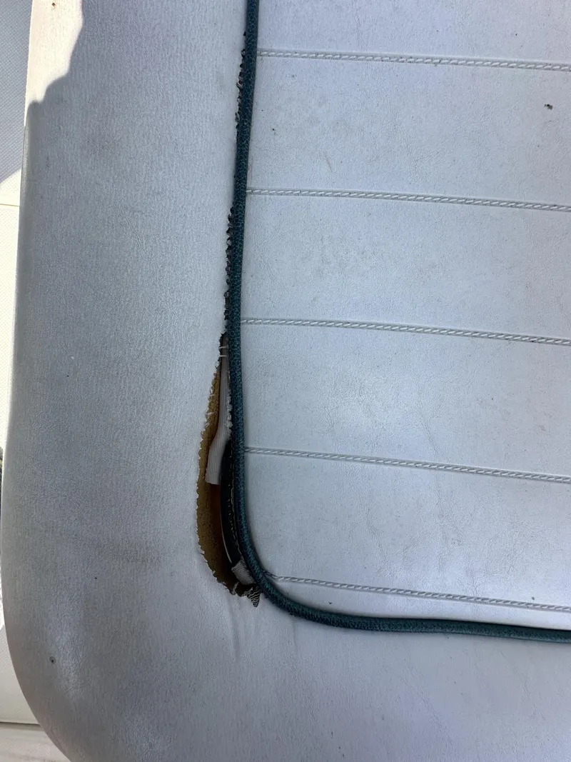 Slide: The Image of Torn upholstery on a 1998 Maxum 2800 SCR boat seat. - 41