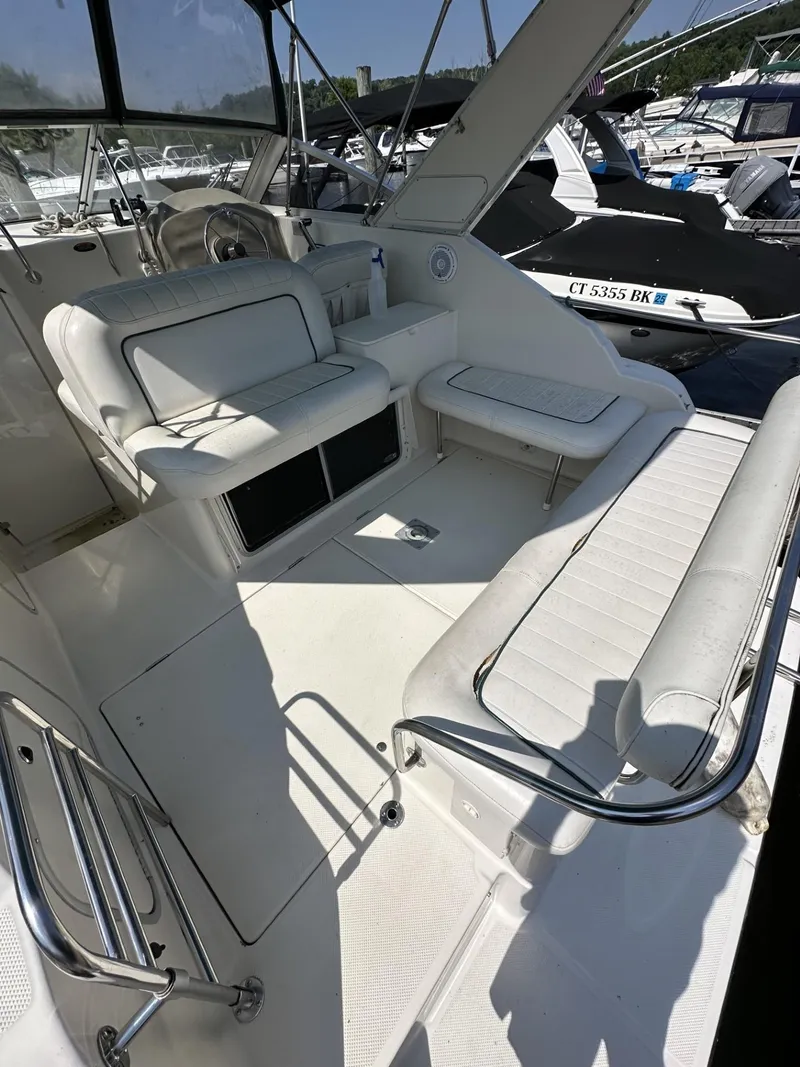 Slide: The Image of 1998 Maxum 2800 SCR boat interior with white seating and helm station. - 6