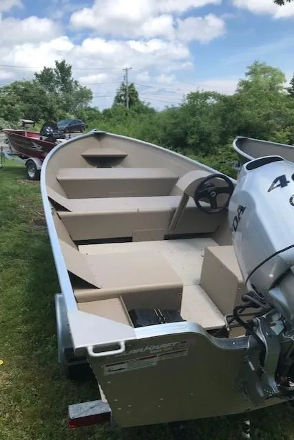 Slide: The Image of 2024 Polar Kraft Dakota 1670L aluminum fishing boat with outboard motor. - 6