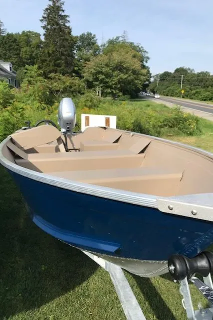 Slide: The Image of 2024 Polar Kraft Dakota 1670L boat on trailer, blue exterior, beige interior. - 8